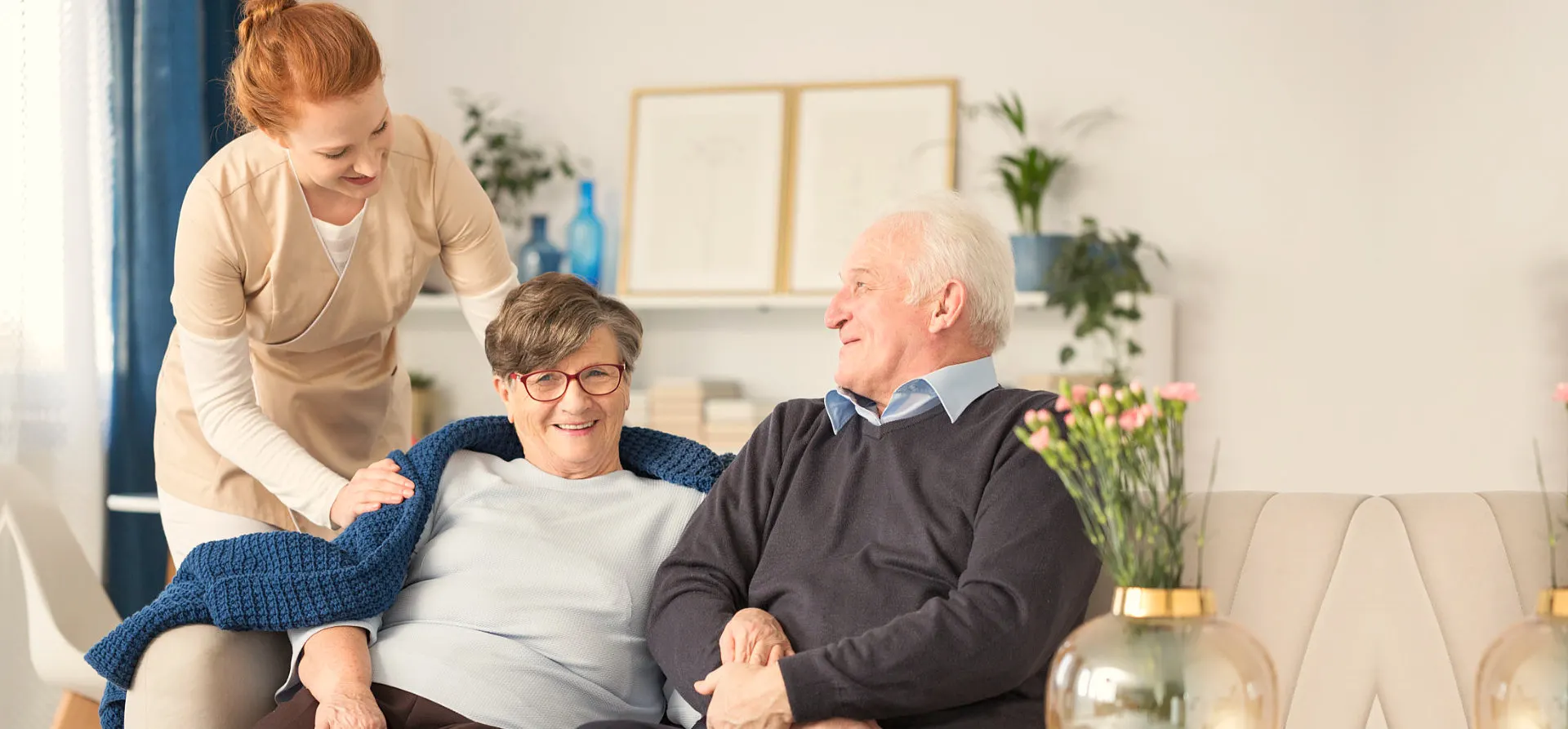 senior couple with caregiver