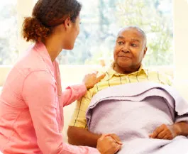 caregiver talking with her patient