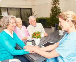 seniors talking to caregiver