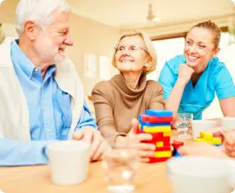 senior couple with caregiver